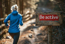 Be Active Concept Image With An Old Elder Active Woman And Board Sign With Written Words Be Active To Encourage Elderly People To Move And Do Sports And Activities