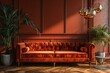 Terra cotta velvet sofa near wainscoting paneling wall. Mid century interior design of modern living room.
