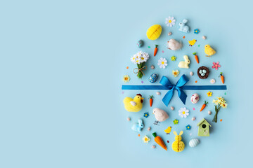 Wall Mural - easter objects laid out in the shape of an easter egg