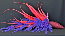 Sculptural Red Spikes & Blue Lavender Floral Arrangement On Dark Backdrop, Perfect For Avant-garde Art Themes