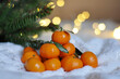 fresh tangerines in christmas festive background