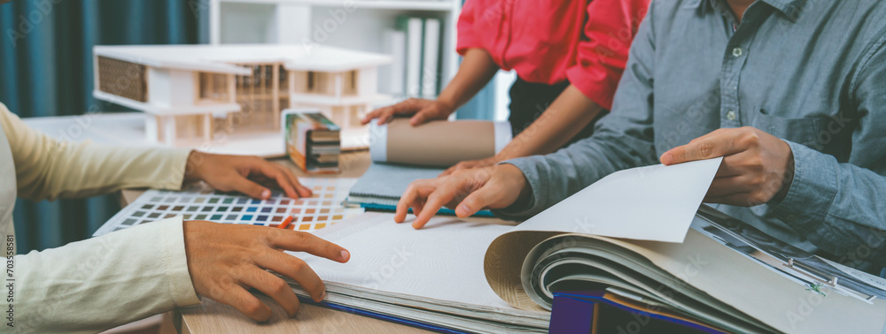 Team Contract Design Skilled interior design team carefully selecting curtain materials ...