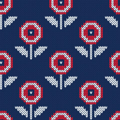 Wall Mural - Floral knitted seamless pattern. Red and white flowers on navy blue background. Retro style. Vector illustration.