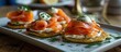Smoked salmon and dill garnished blini with sour cream.