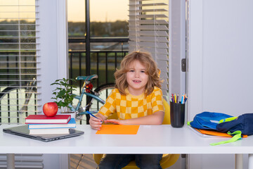 Aufkleber - Little student school child doing homework at home. Portrait of nerd student writing school homework. Pupil kid preparing school homework, sitting at table.