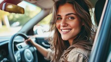 Happy Young Female Sitting In The Driver's Seat Of A Car