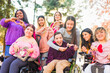 © Sangiao_Photography - International womens day Inspire Inclusion multiethnic group do love heart with hands. Wheelchair