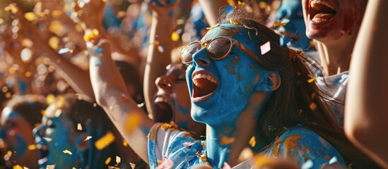 Sports stadium event: Fans cheer for the blue soccer team, celebrate goal and championship victory. Friends with painted faces have emotional fun.