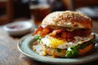 A delicious bacon and egg sandwich served on a bun, perfect for breakfast or brunch