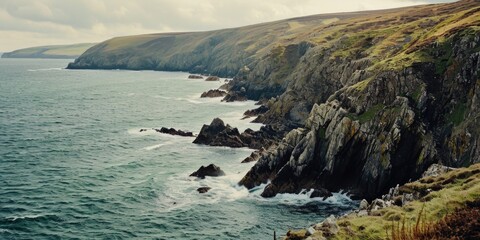 Aufkleber - A breathtaking view of the ocean from a cliff. Perfect for travel and nature-themed projects