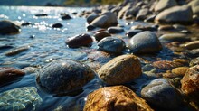 Smooth River Pebbles Under Clear Water.