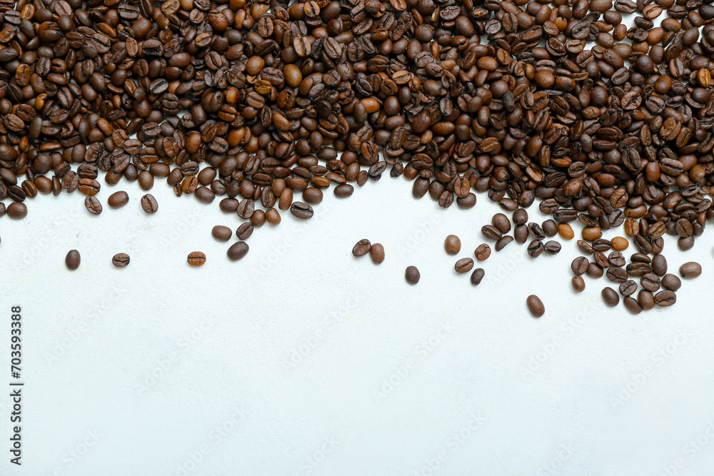 Frame made of coffee beans on light background