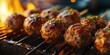 Close up shot of meatballs cooking on a grill. Perfect for food enthusiasts and barbecue lovers.