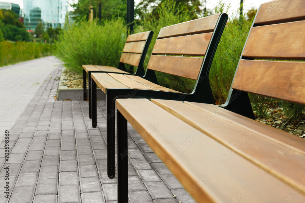 Wooden benches in park, closeup