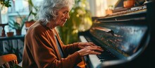 Elderly Woman With Gray Hair Is Practicing Digital Piano At Home.