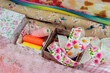 Sewing accessories close-up. Fabric, decorative ribbons, threads in boxes. Tailoring.