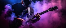 Musician Playing Guitar With Purple Flare. Dark Background