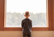 © kieferpix - thoughtful child at home looking out his window