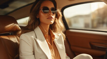 Stylish Female Model Wearing A White Trench Coat And Sunglasses Sits In A Brown Luxury Car, Luxury Style