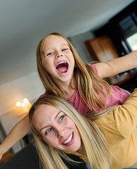 Wall Mural - mother child daughter fun family woman girl happy together happiness teenager piggyback cheerful togetherness bonding parent love young joy