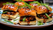 A Plate Of Teriyaki Salmon Sliders With Pickled Ginger And Green Onions
