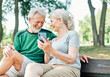© Lumos sp - woman man outdoor senior couple happy lifestyle retirement together  love fun elderly active mobile smartphone communication phone sport active activity fitness outfit training healthy