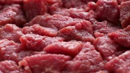 Wall Mural - Fresh raw red beef meat slices circle rotation close up