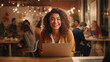 © Alex - Young beautiful freelancer woman laughing. Working on a laptop.