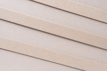 Wall Mural - three cardboard stripes on plain brown paper surface