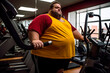 © schukoba - Fat man in gym, fat man doing sports, overweight, man with beard