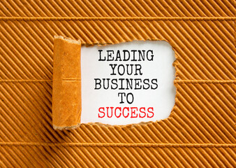 Wall Mural - Leading your business to success symbol. Concept words Leading your business to success on beautiful white paper. Beautiful brown paper background. Leading your business to success concept. Copy space