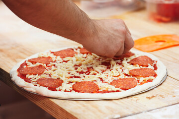 Poster - Cooking pizza in a pizzeria or restaurant