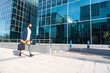 © unai - Businessman with prosthetic leg arriving at a financial building