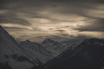 Wall Mural - strong south wind in the alps at a cloudy and sunny winter day in the national park hohe tauern in austria