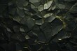  a close up of a wall made up of many different shapes and sizes of black and gold foiled material with a light reflection on the surface of the wall.