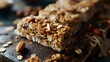 Healthy granola bars with nuts on wooden board, selective focus