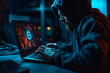 A hacker in a hoodie is sitting in a dark room and hacking into a computer system. Displays show graphs, charts, and maps. Dark internet, darknet concept