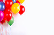 Colorful party balloons on white background.