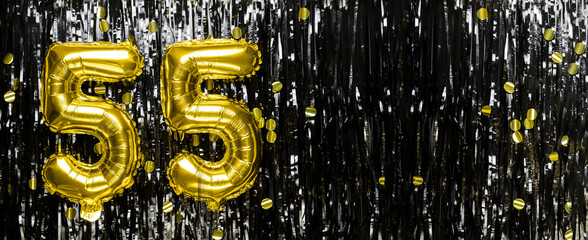 Wall Mural - Gold foil balloon number number 55 on a background of black tinsel decoration. Birthday card, inscription fifty-five. Anniversary event. Banner.