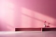 A pink minimalist room with a pink flower on a pink table