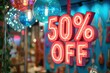a vibrant neon 50% off sale sign