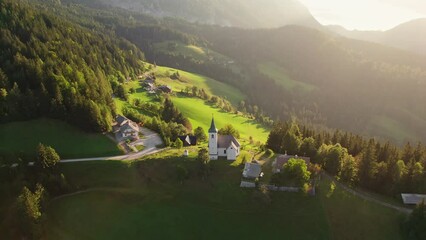 Wall Mural - Aerial view of the beautiful Slovenian Alpine landscape with St Spirit church