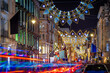 Crowded New Bond street decorated for Christmas, London, England