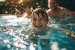 A young boy's joyful smile reflects in the shimmering pool water as he swims alongside a man and woman, embracing the outdoor sport of swimming