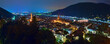 Heidelberg, Germany. Night high angle panoramic view of Heidelberg Old Town with Jesuit Church, Church of the Holy Spirit and Old Bridge (Karl Theodor Bridge) across the Neckar river.