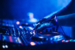 © Zamrznuti tonovi - Cropped picture of dj hands performing live music on festival.