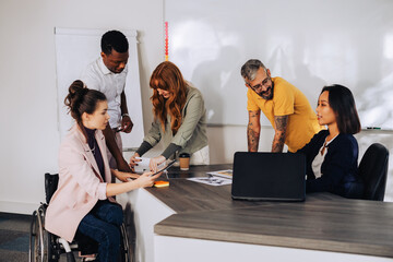 A diverse inclusive businesspeople working on project at office.