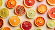 Variety of citrus fruit including lemons, grapefruits, blood oranges. Summer fruit nature pattern on a soft peach colored background. Raw food concept. Flat lay, top view.