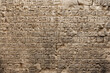 Wall texture material of stone with cuneiform like carvings, worked surface