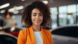 © duyina1990 - Confident young businesswoman standing in a car showroom